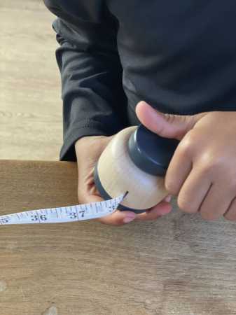 Metermass aus Holz aufrollbar