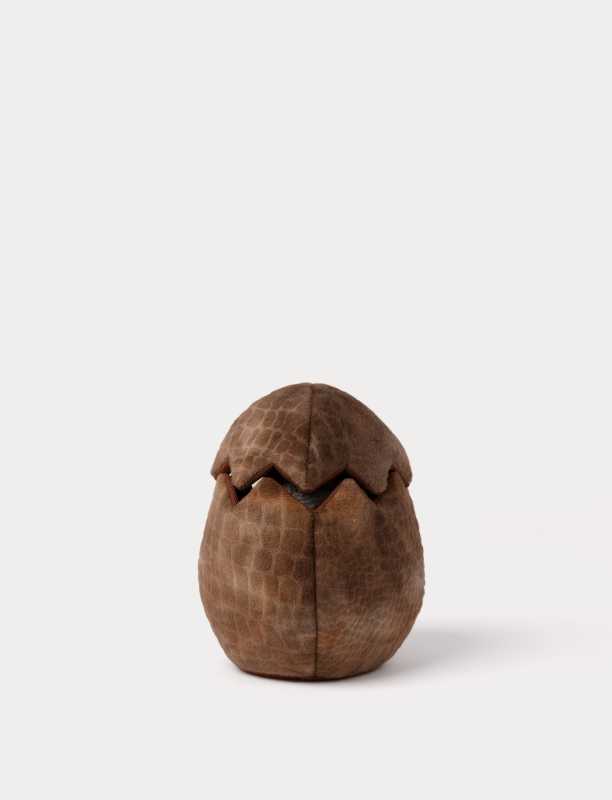 Handpuppe Stegosaurus in einem Ei